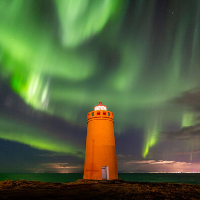Aurora Borealis over Holmsberg Lighthouse, Keflavik, Iceland