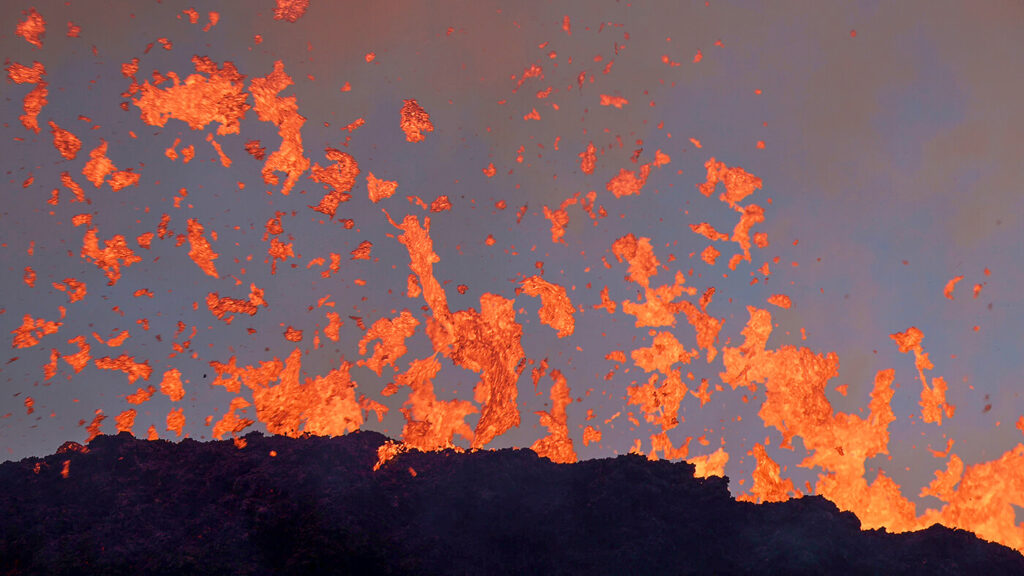 Molten lava flying out of the crater